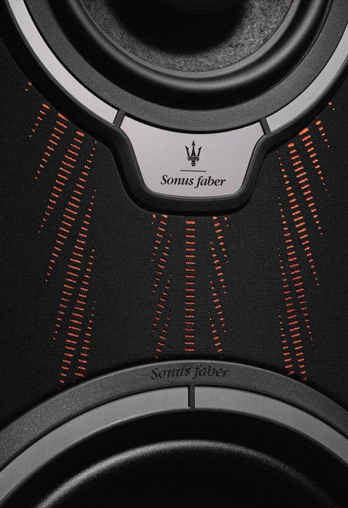 Sonus faber speaker detail showcasing the woven pattern and branded emblem.